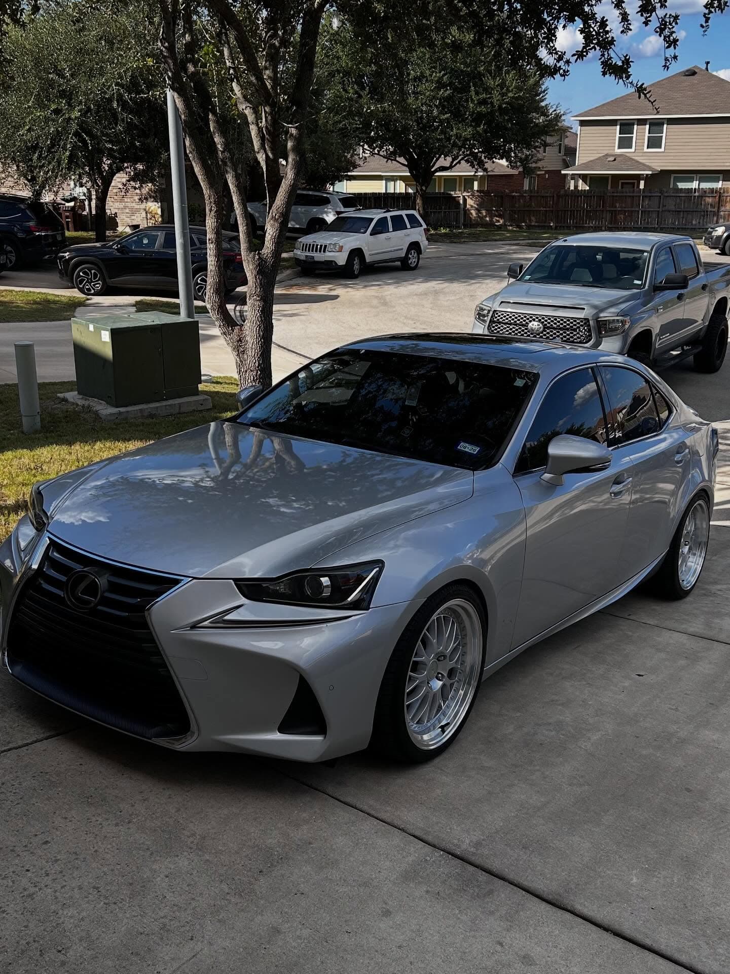 Silver Lexus sedan with reflective paint finish